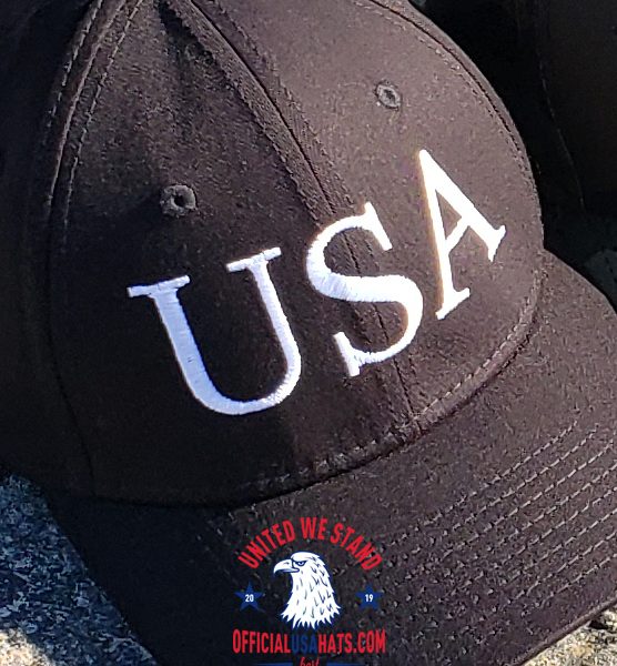 Black USA Hat with White text - Front on stone close up