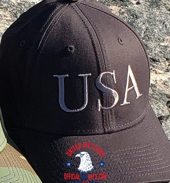 Black USA Hat with Dark Gray text - Front on stone close up