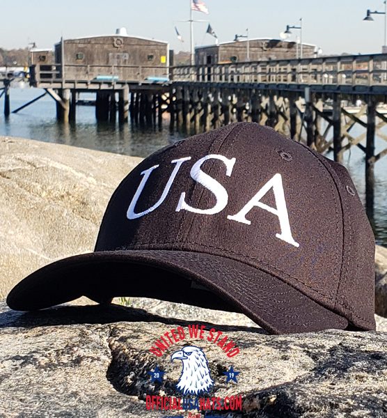Black USA Hat with White USA text - Front on stone