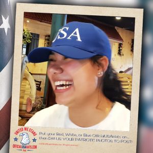 Girl wearing our blue USA hat laughing