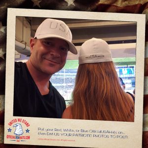 Guy and girl wearing Official White USA Hats at baseball game